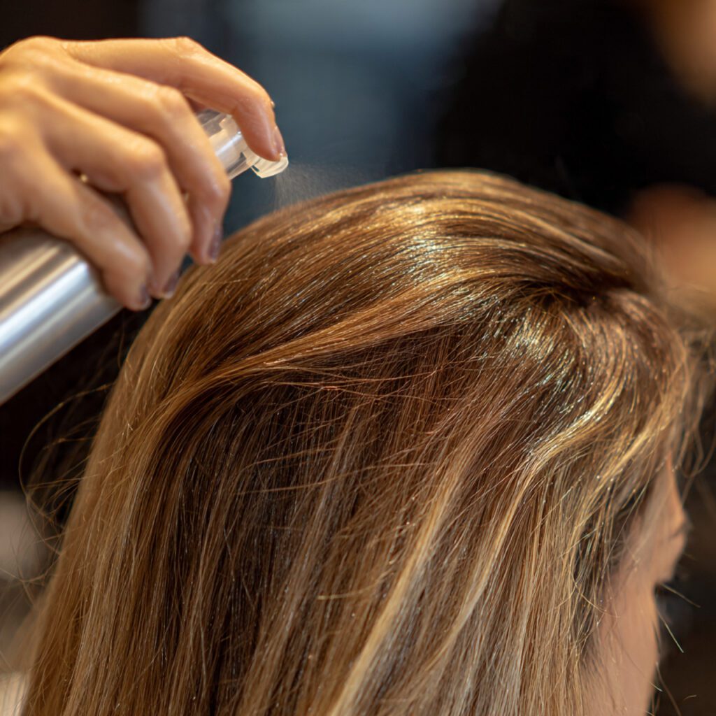 fine_hair_being_treated_with_root_lifting_spray
